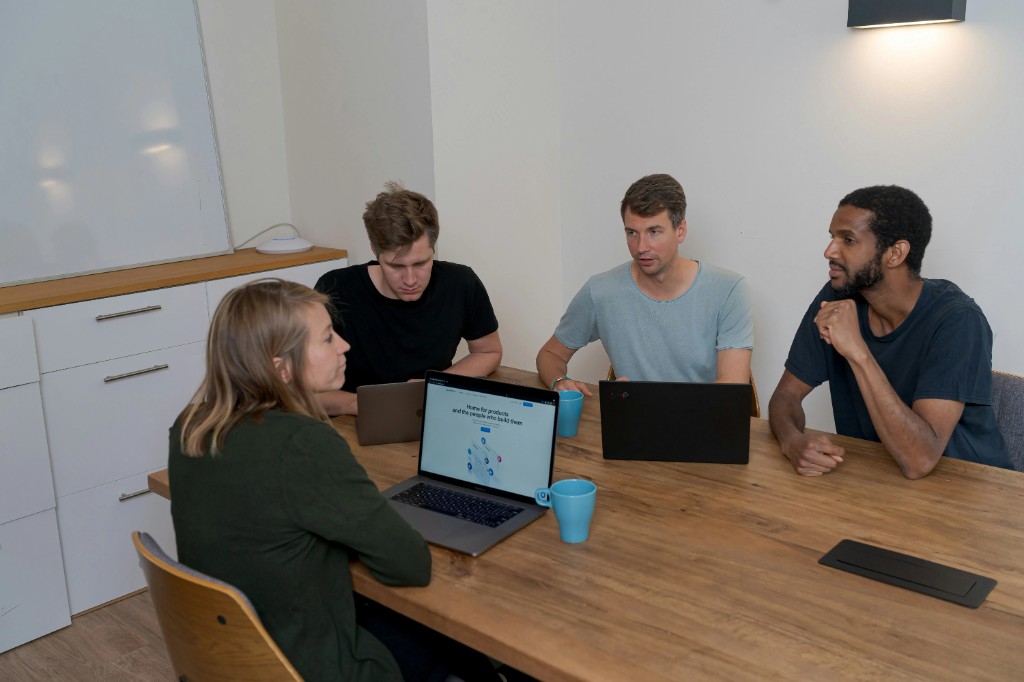 Diverse software development team collaborating in a planning meeting